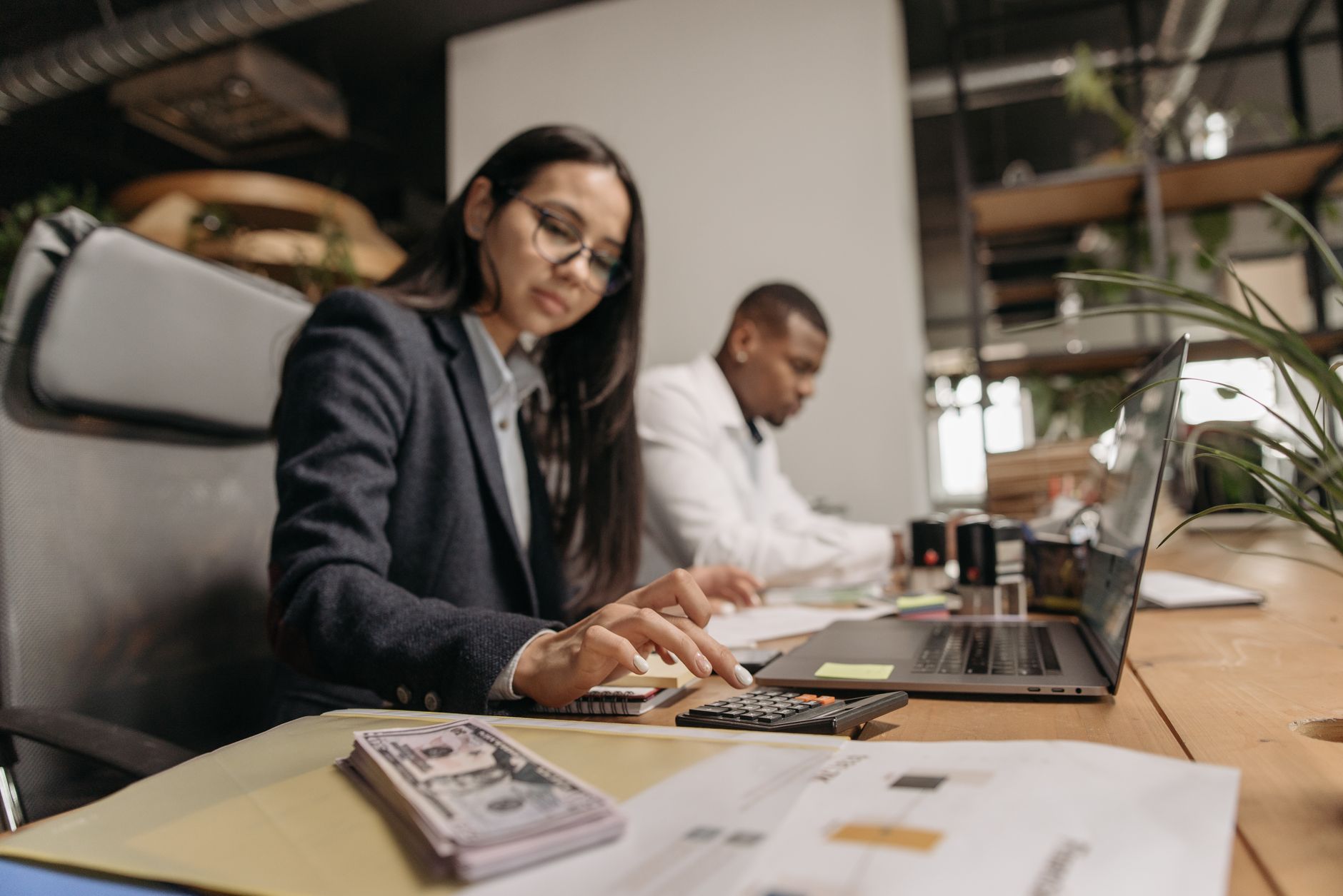 UK small business owner reviewing AI accounting software on a laptop