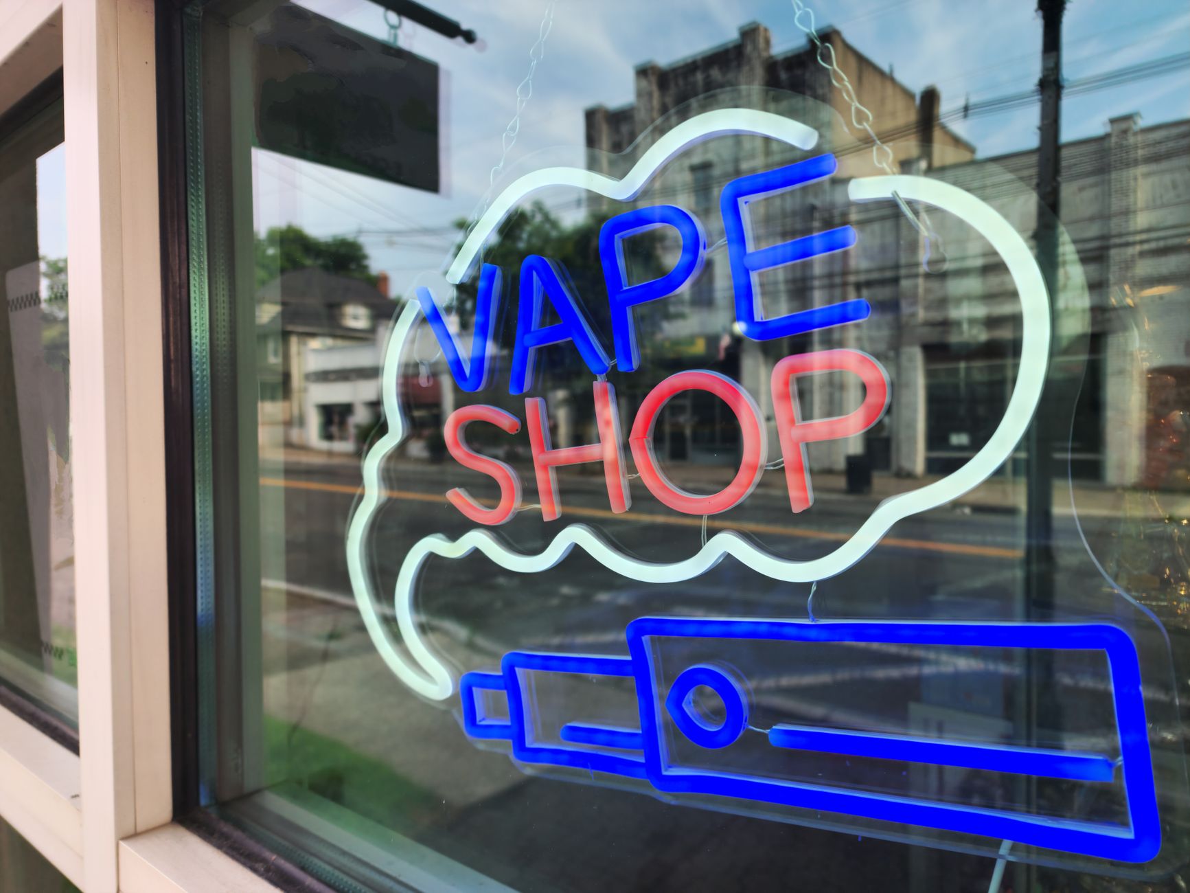 Neon vape shop window sign, illustrating councils' new powers over vape and betting shops
